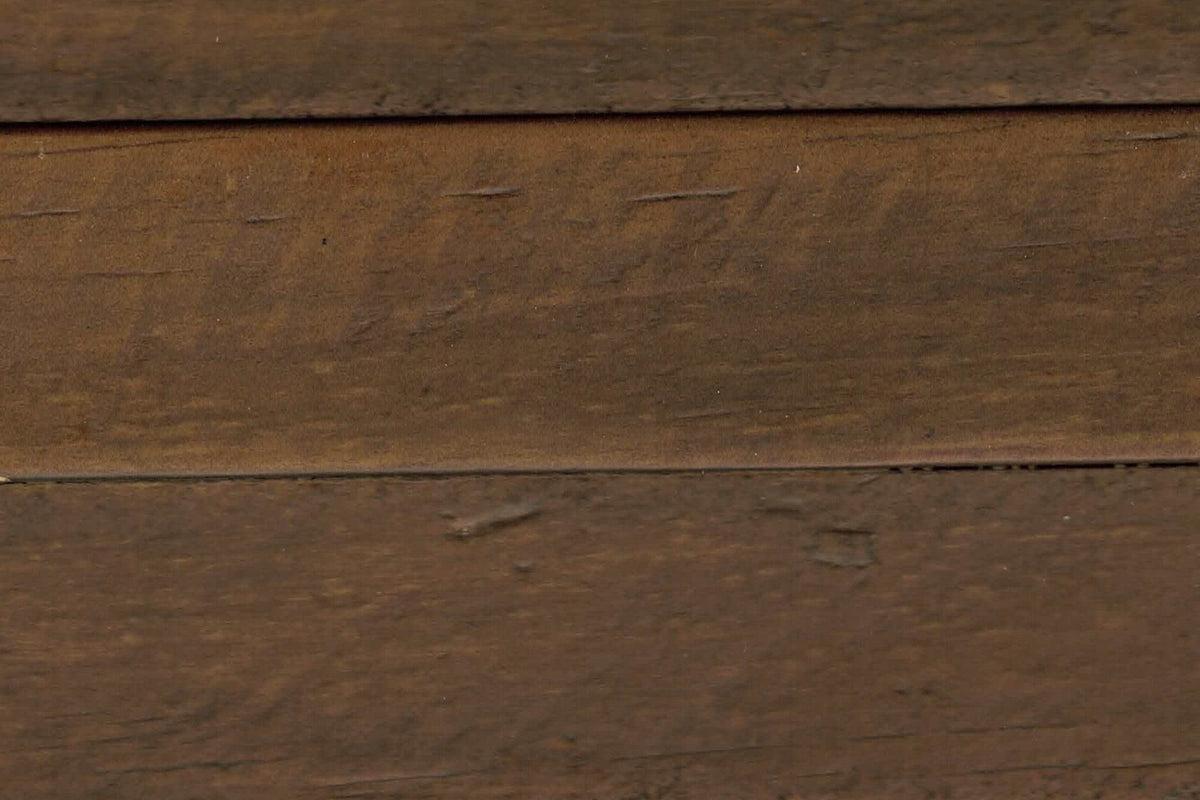Close-up of the Cervinia finish: weathered brown reclaimed pine boards with saw marks and small dents