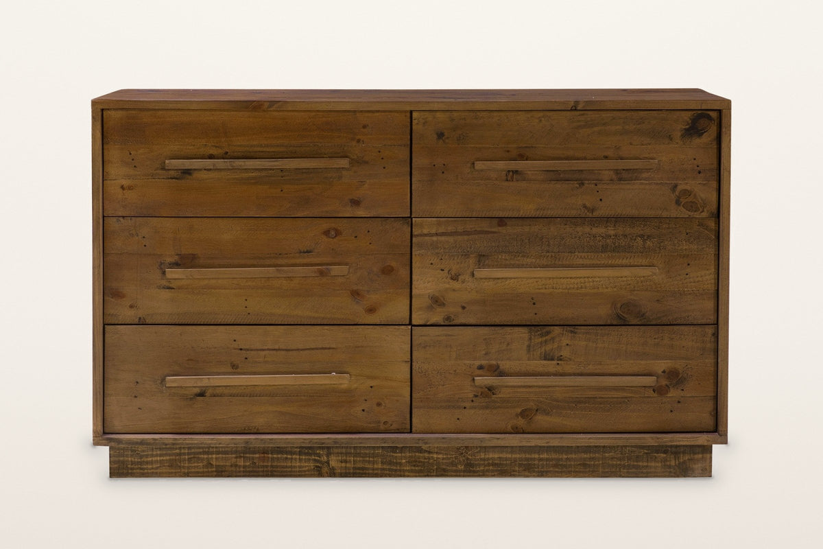 Cervinia dresser from the front: six drawers in two columns of three, each with one long wooden bar pull, a plank top and a recessed plinth