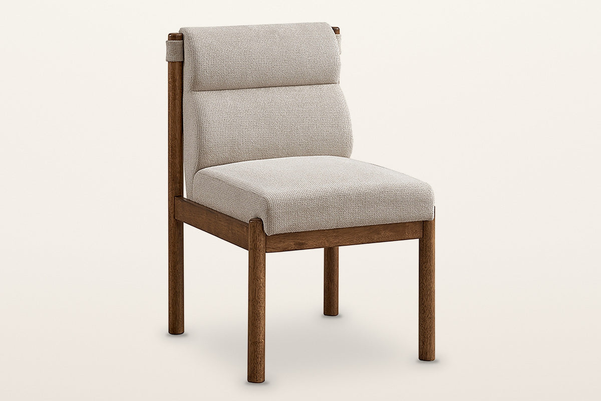 Cervo upholstered dining chair in beige and walnut, three-quarter view on a warm white studio backdrop