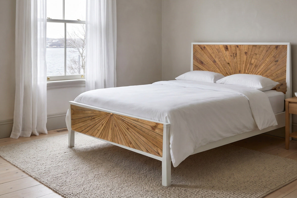 Cesana sunburst bed made up with white linen in a calm South End, Halifax bedroom, the harbour through a tall sash window