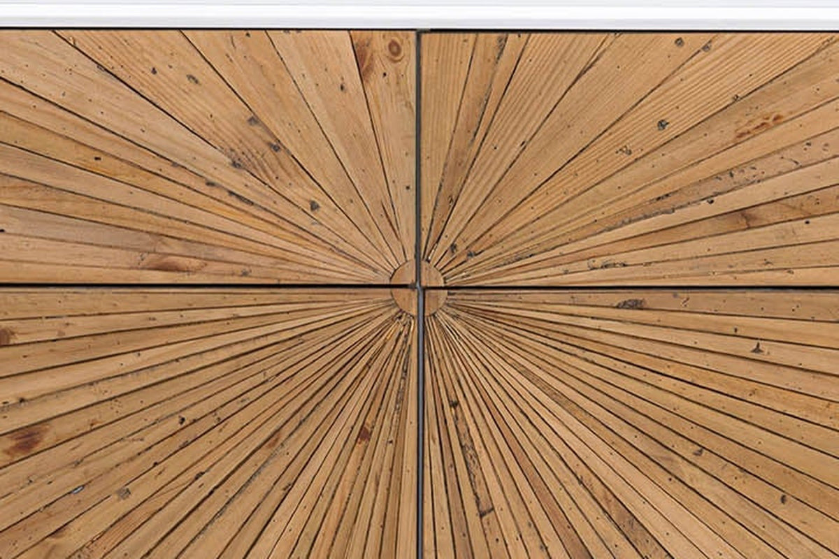 Close-up of the Cesana dresser front: narrow reclaimed pine strips meeting at a small round button split by the drawer gaps