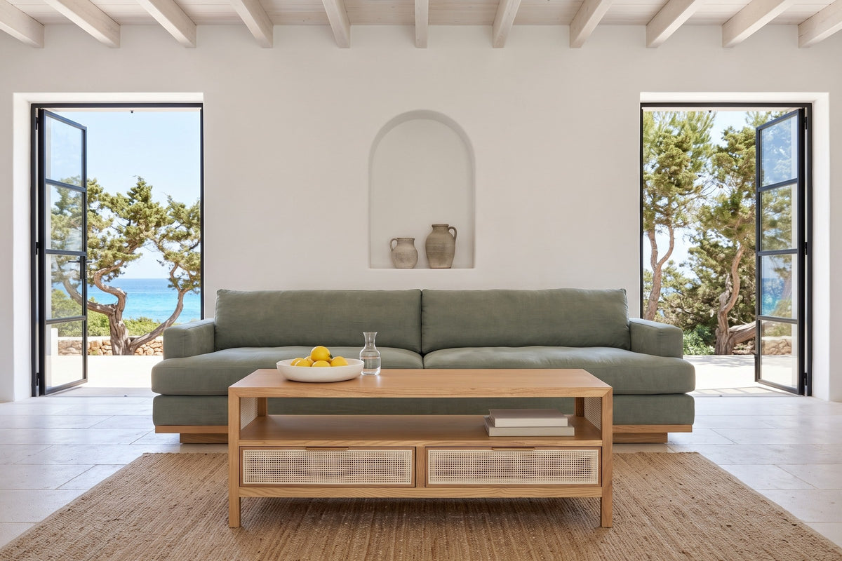 Cetara coffee table in Natural ash and wicker in a Formentera house, with white lime plaster, an arched niche