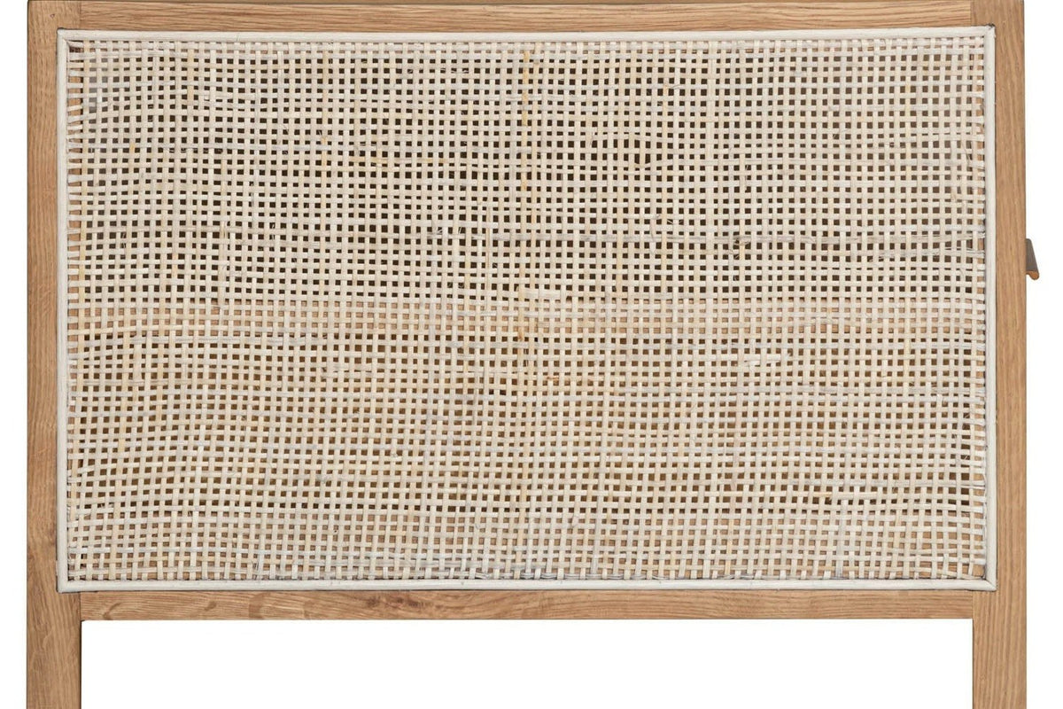 Close-up of the Cetara end panel: an open square weave of pale wicker with an off-white woven border in a natural ash frame