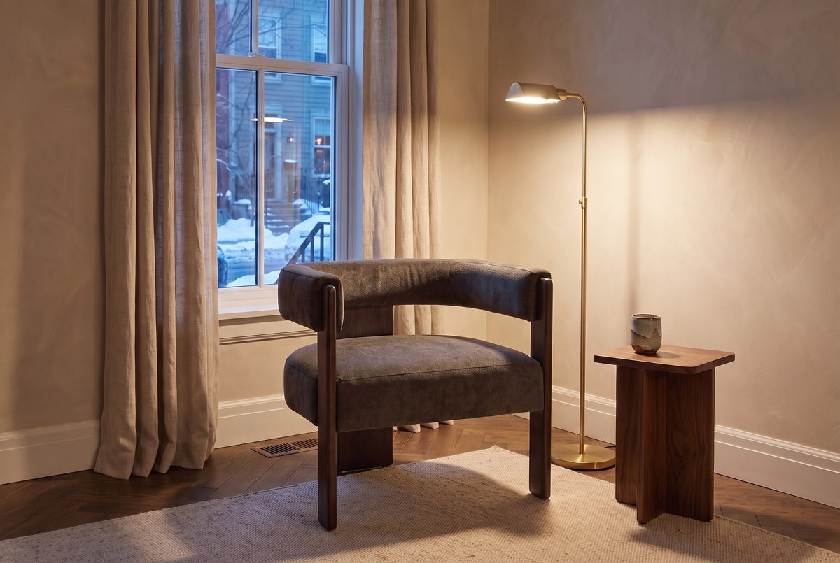 Chioggia accent chair in a townhouse reading corner at dusk, a brass floor lamp lit beside it (Dark Brown)