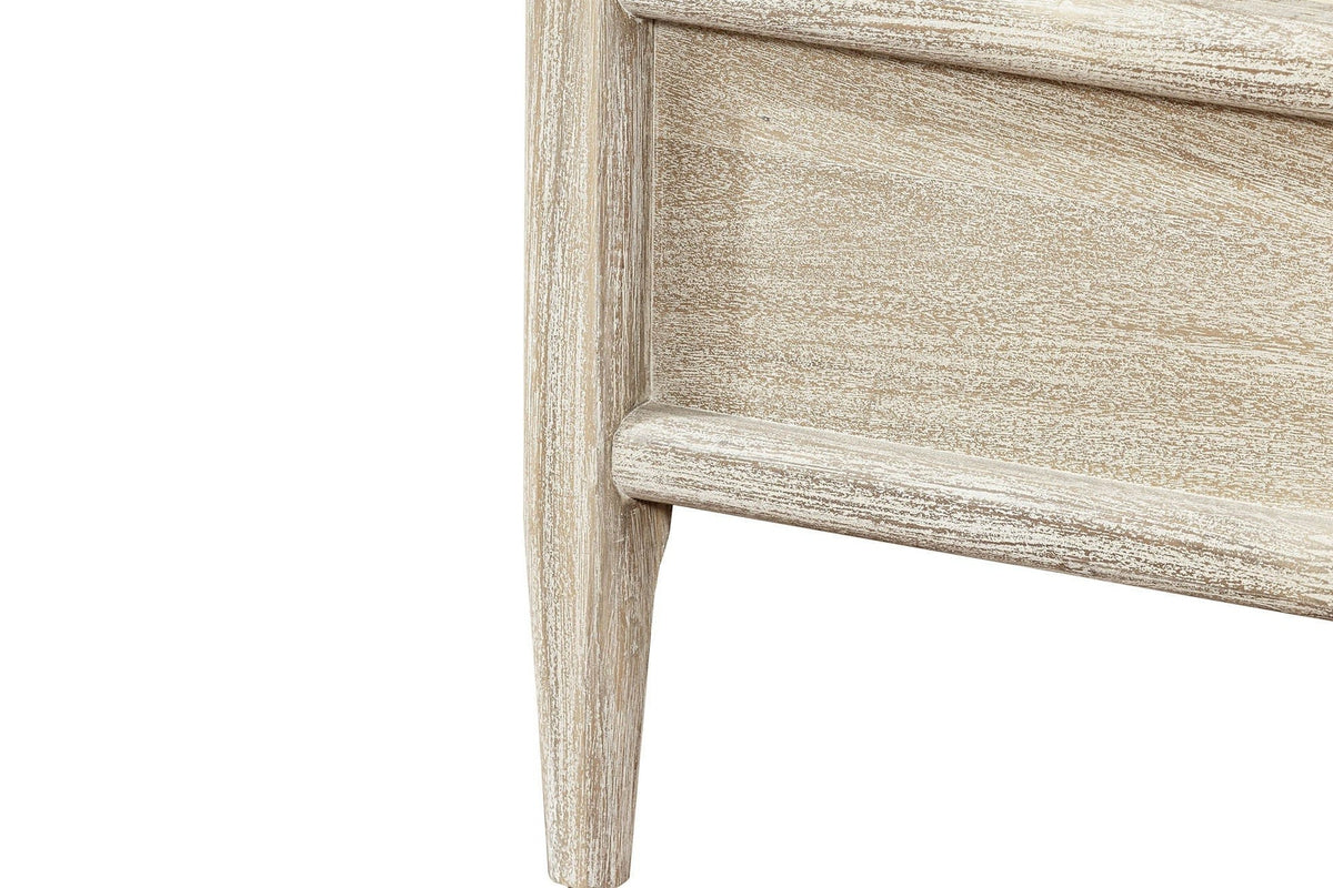 Close-up of a Chiusdino foot corner: the tapered leg and the rounded top and bottom mouldings of the rail