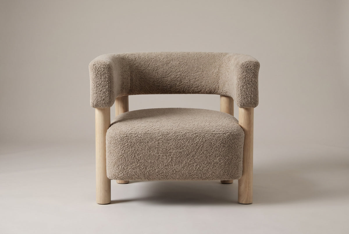 Cingoli chair in Light Camel boucle, straight front view: one curved back-and-arm band on four round wood legs