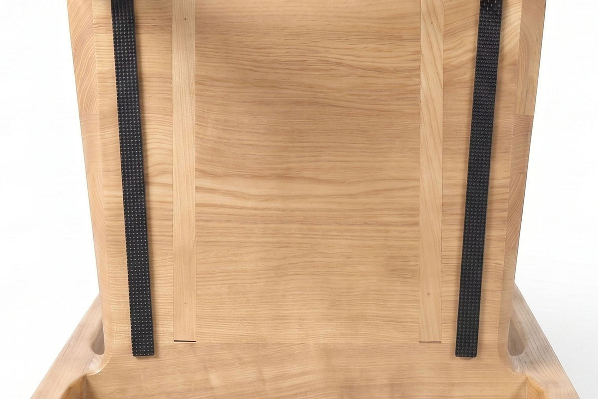 Close-up from below of the Cison seat in Natural: solid ash boards side by side