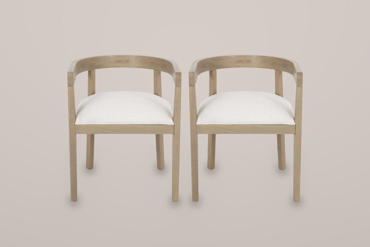 The Civita set of 2 horseshoe dining chairs in Beige, straight front view on a warm light-grey studio backdrop