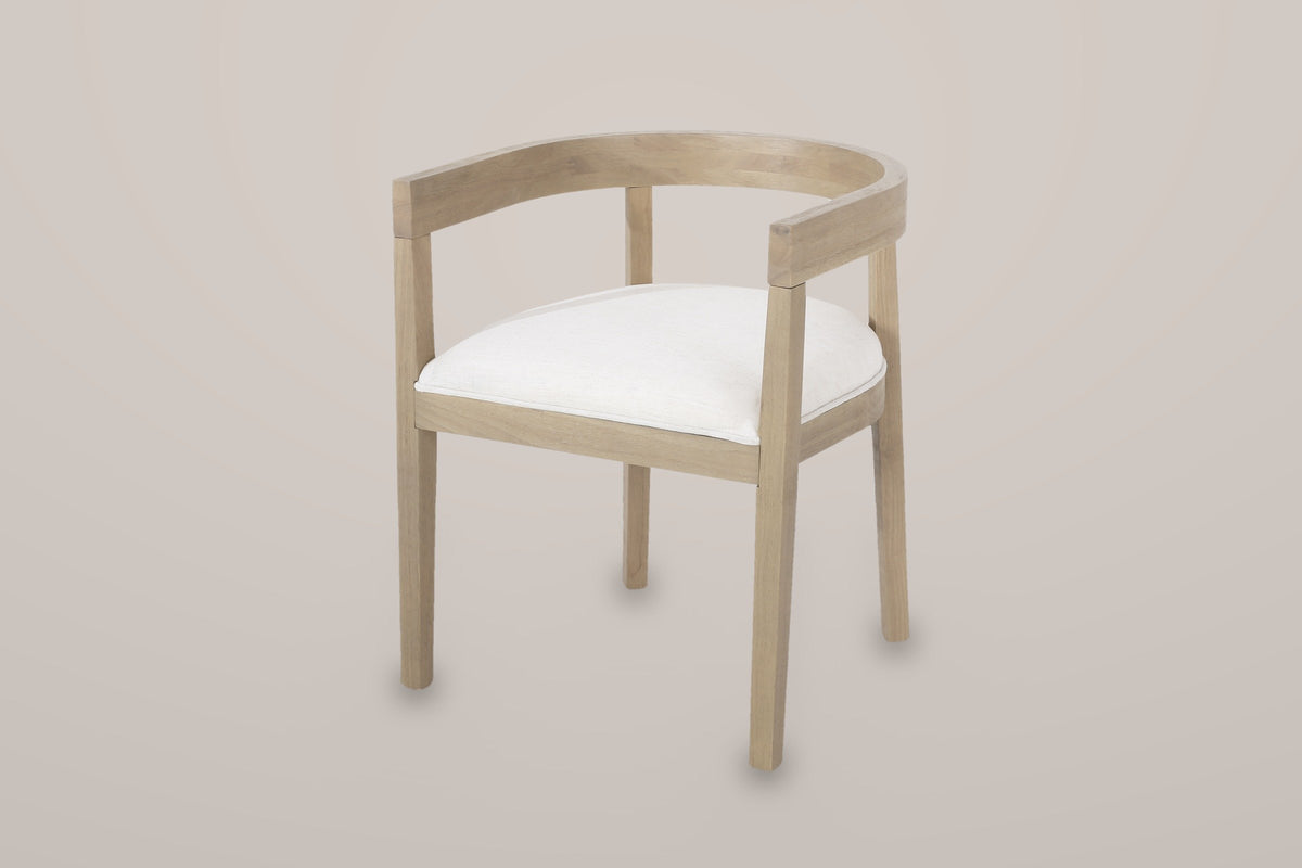 Civita horseshoe dining chair in Beige, three-quarter view on a warm light-grey studio backdrop