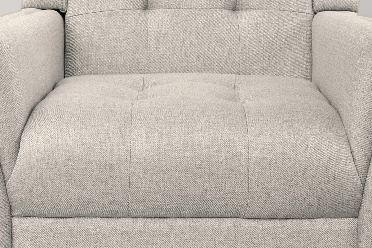 Close-up of the tufted beige seat and lower back, with the sewn tufts and the woven twill fabric