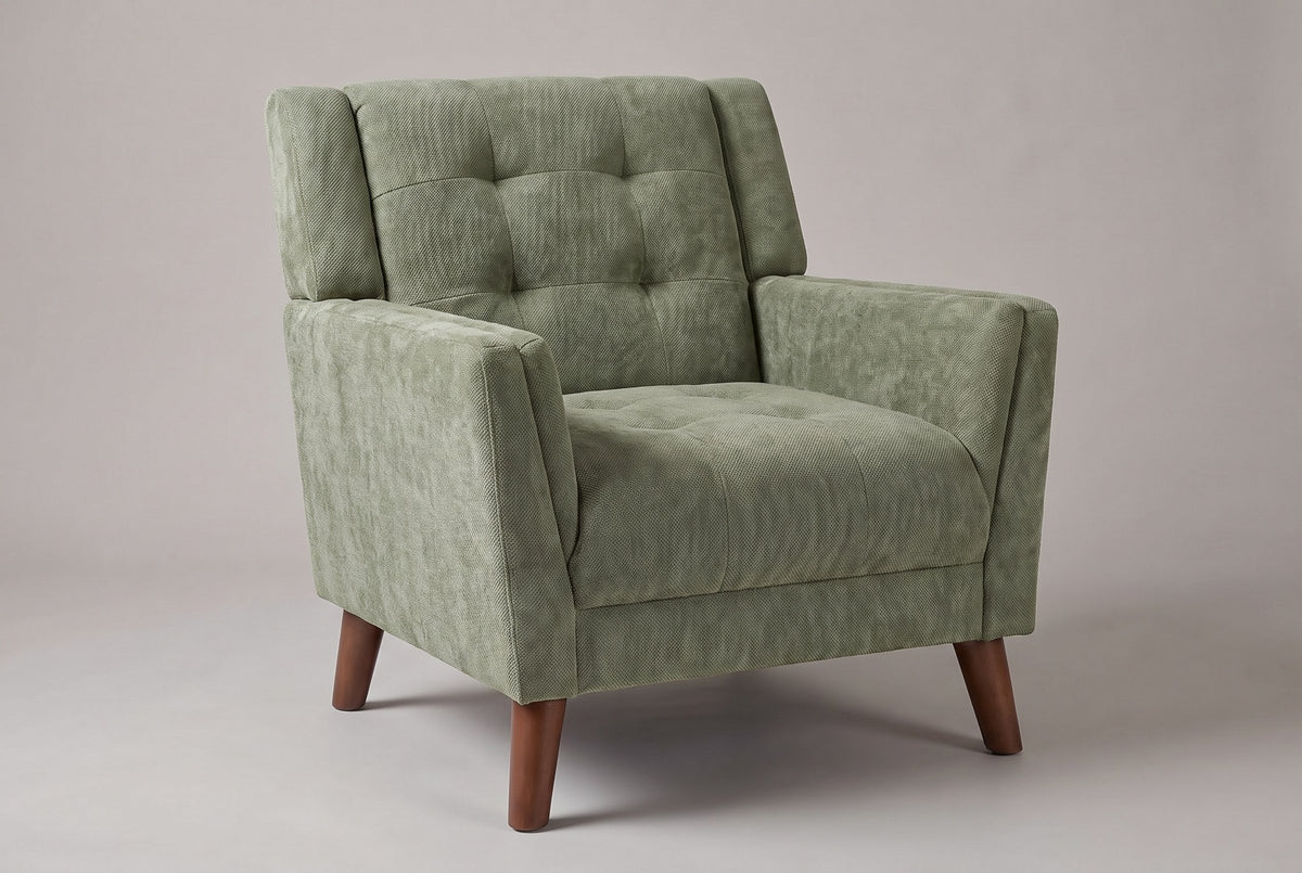 Comacchio tufted mid-century armchair in green chenille, three-quarter view on a warm grey studio backdrop