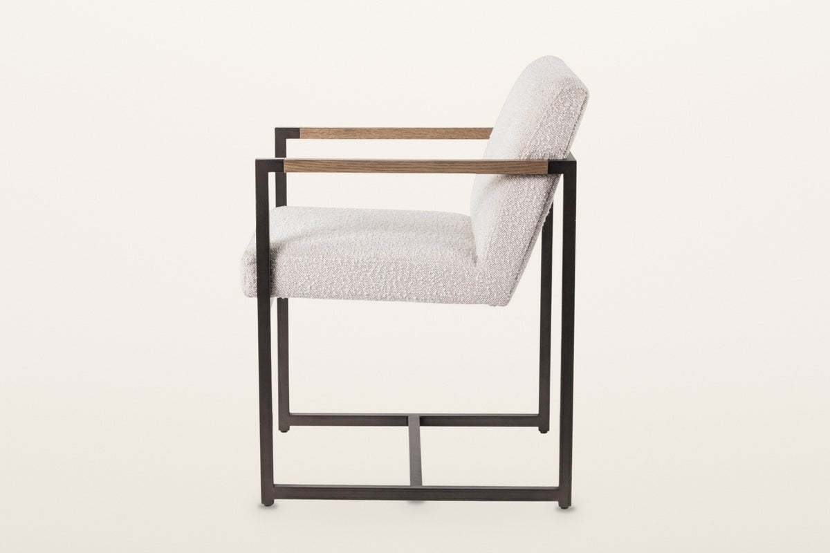 Coreglia dining armchair in White, side view on a warm white studio backdrop: each side frame is one closed rectangle