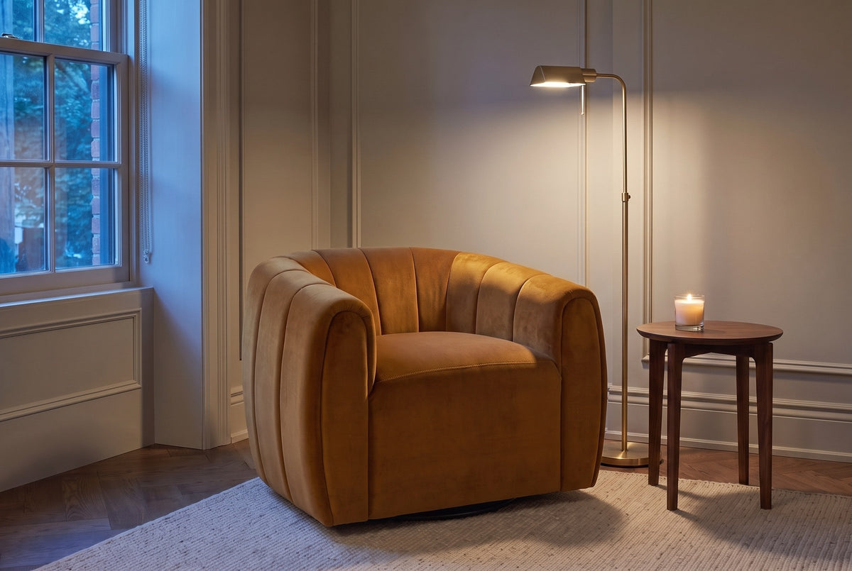 Cuneo swivel chair in caramel velvet in a panelled Toronto townhouse corner at dusk