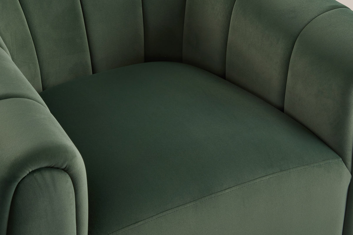 Close-up of the olive green velvet seat with its stitched front seam, the channelled back and arms around it