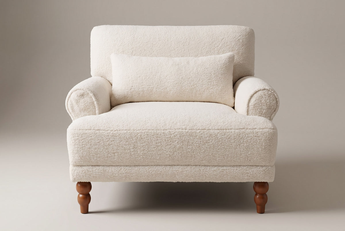 Dolceacqua chair in ivory sherpa, straight front view: rolled arms, one lumbar pillow, turned chestnut legs