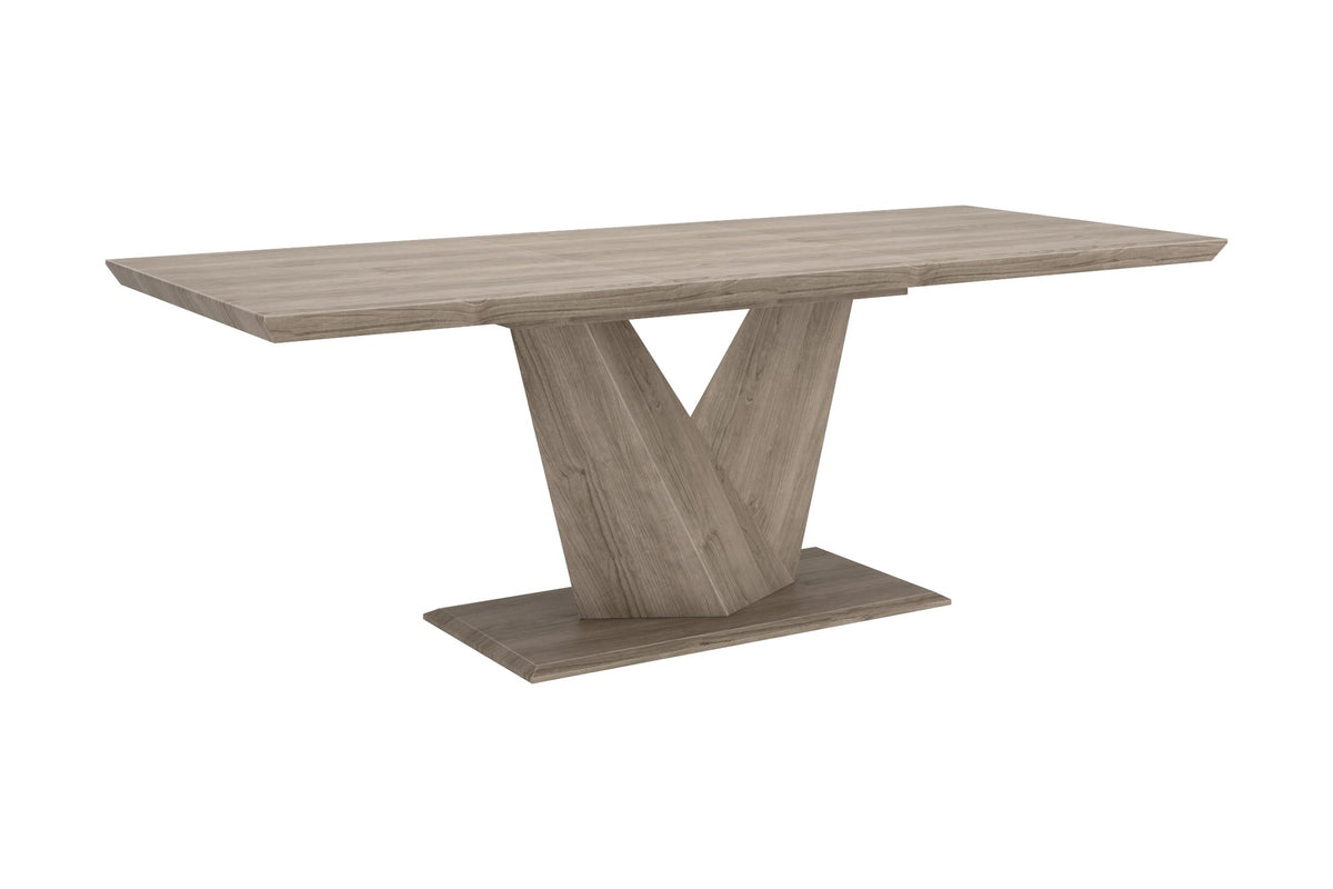 Ellis washed oak extension dining table with V-shaped pedestal base, three-quarter view
