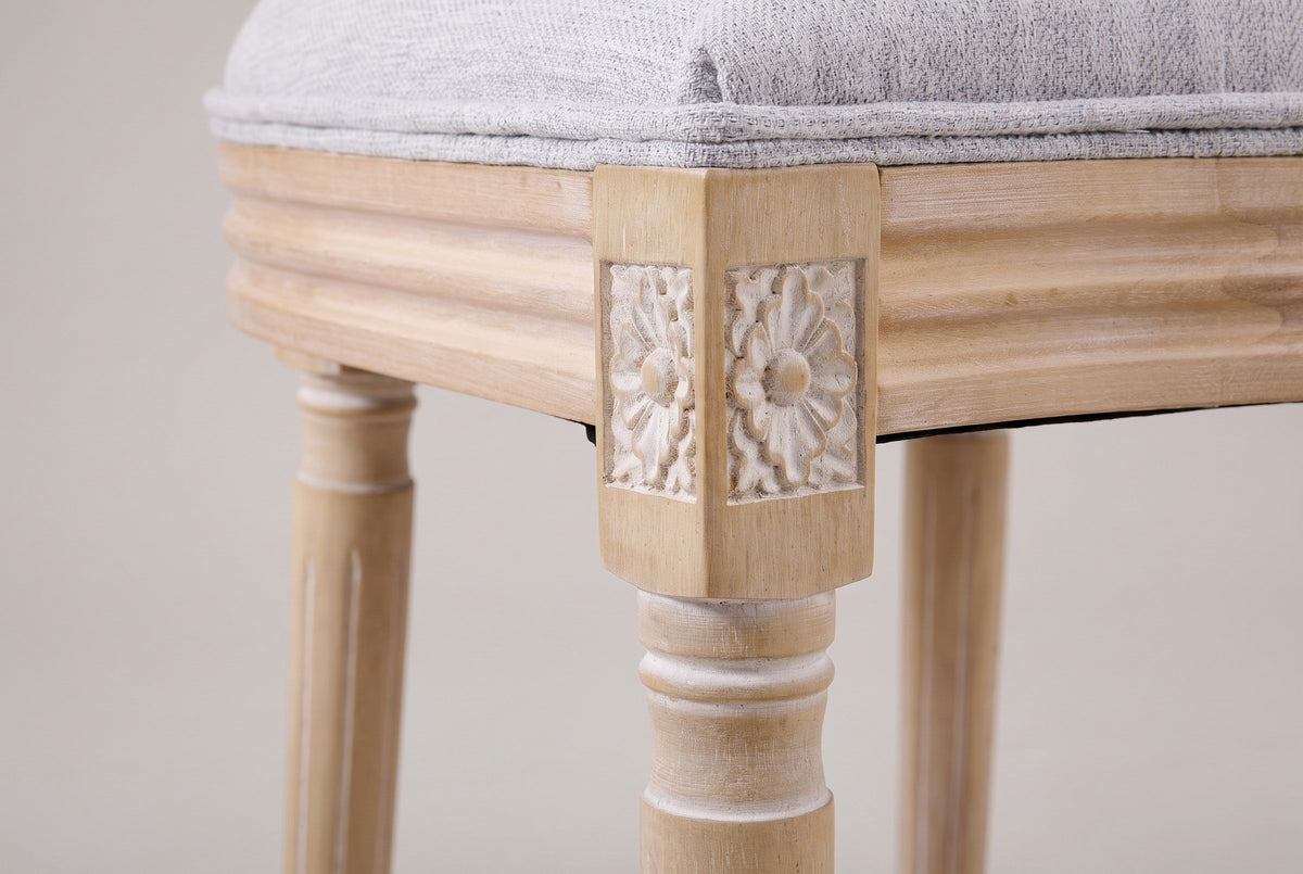 Close-up of the carved rosette corner block and the turned, fluted front leg of the Este chair