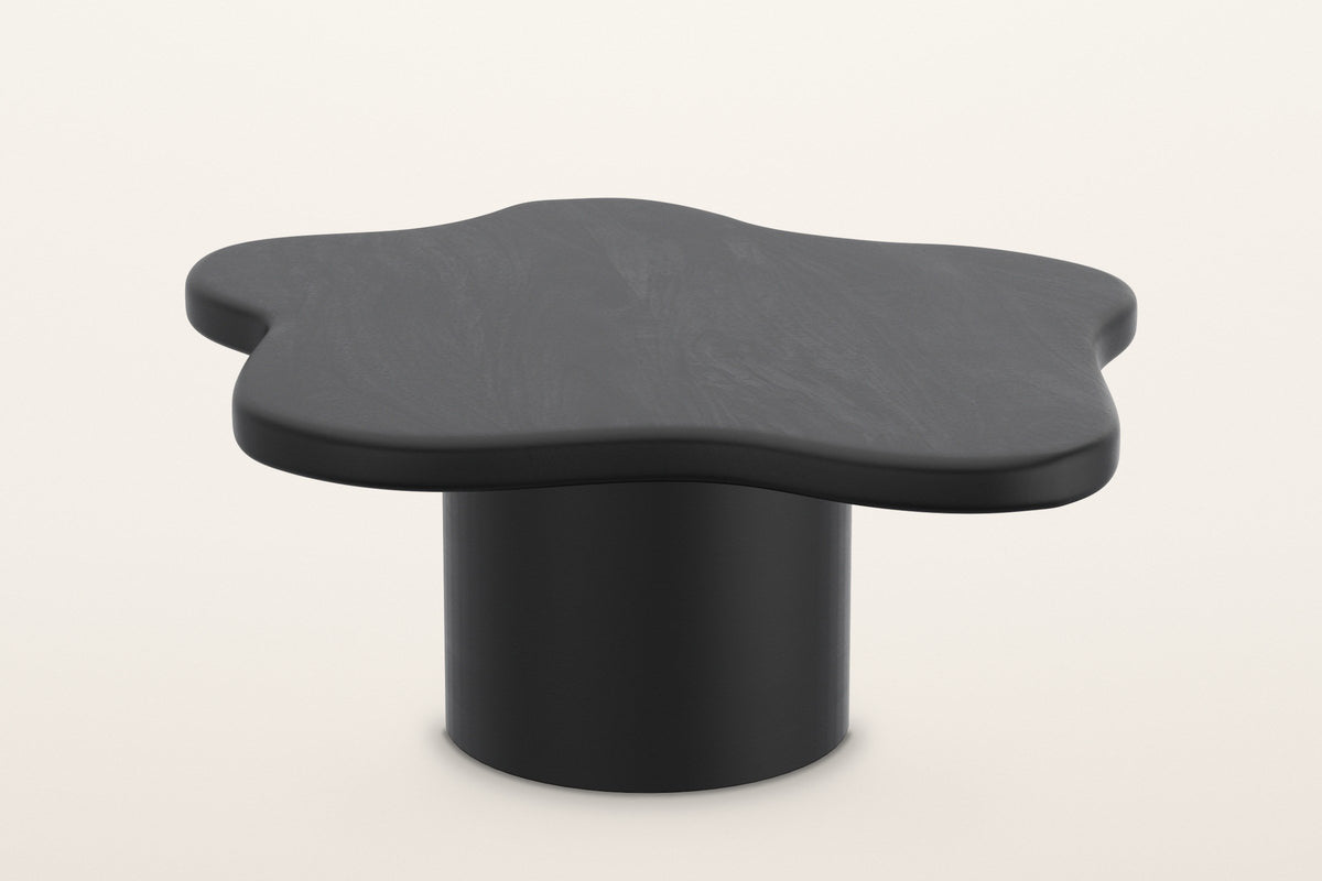 Exilles large cloud coffee table in black, 35.5 in across on one round drum, on a warm white studio backdrop