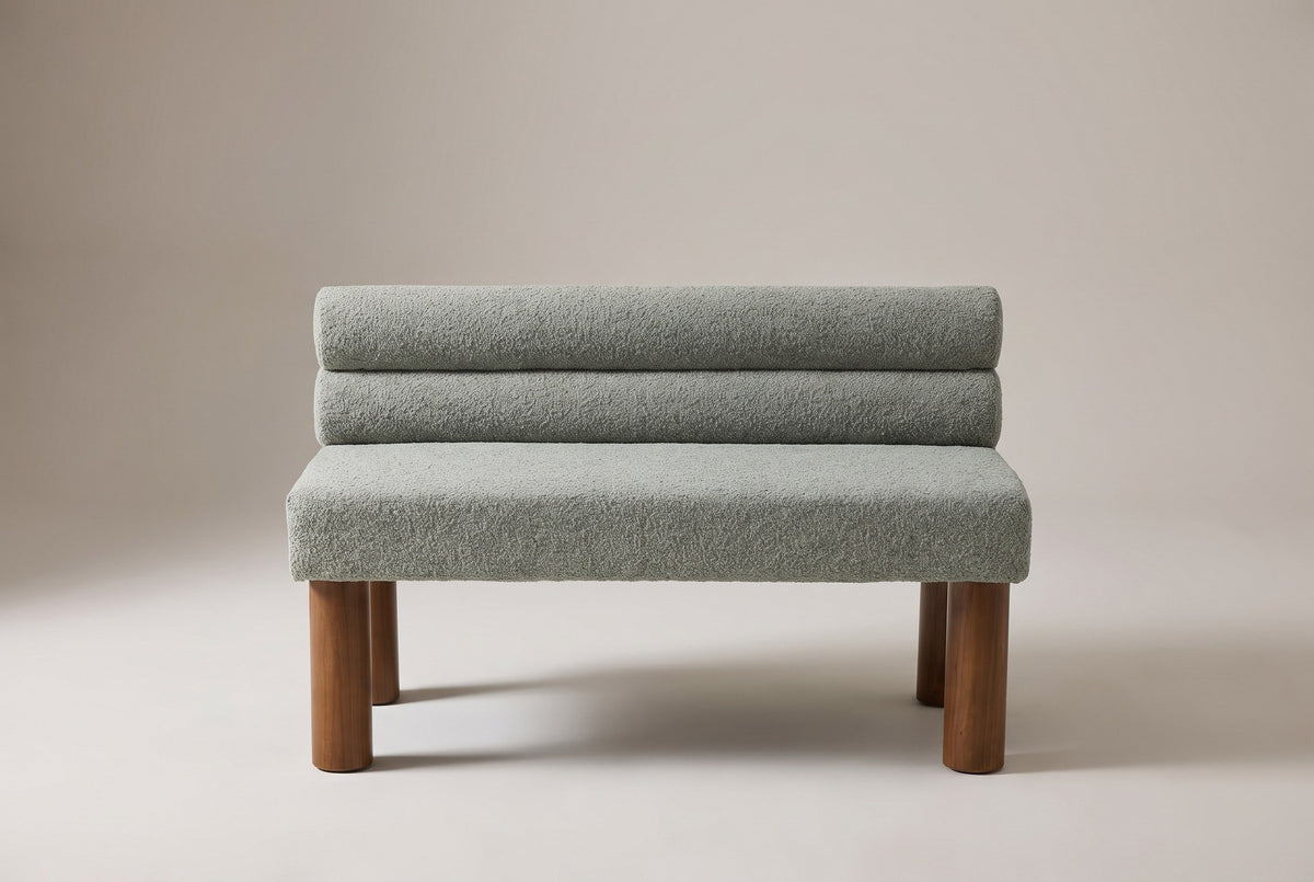 Fabriano bench in sage boucle, straight front view on a studio backdrop