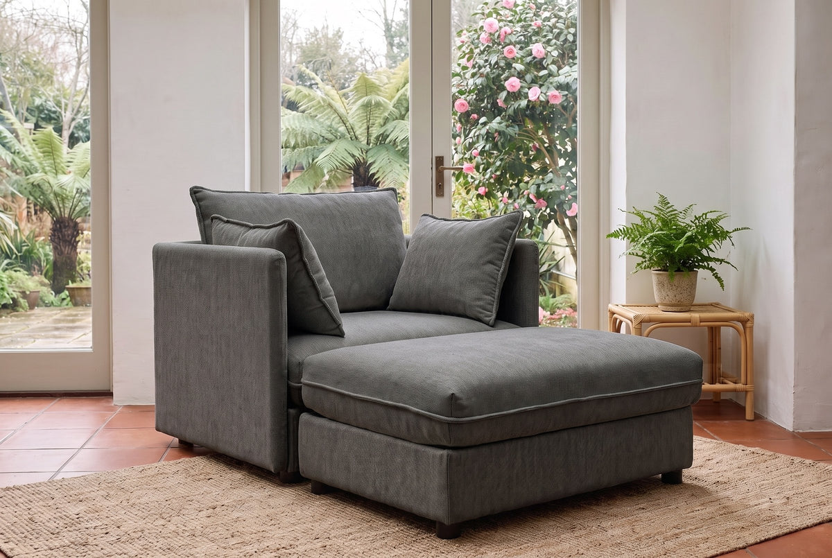 Faenza ottoman pushed against the grey chenille chair to make a lounger