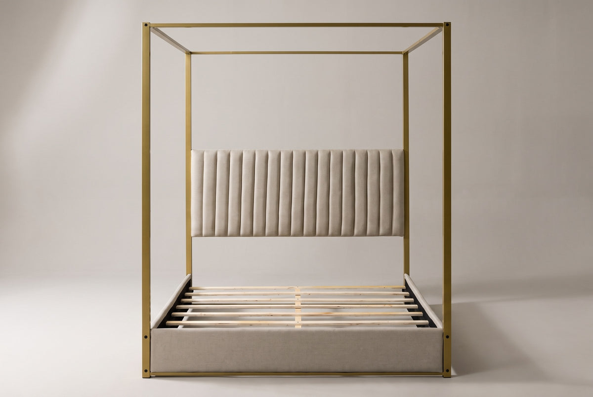 Fermo canopy bed in beige and gold, straight front view on a studio backdrop