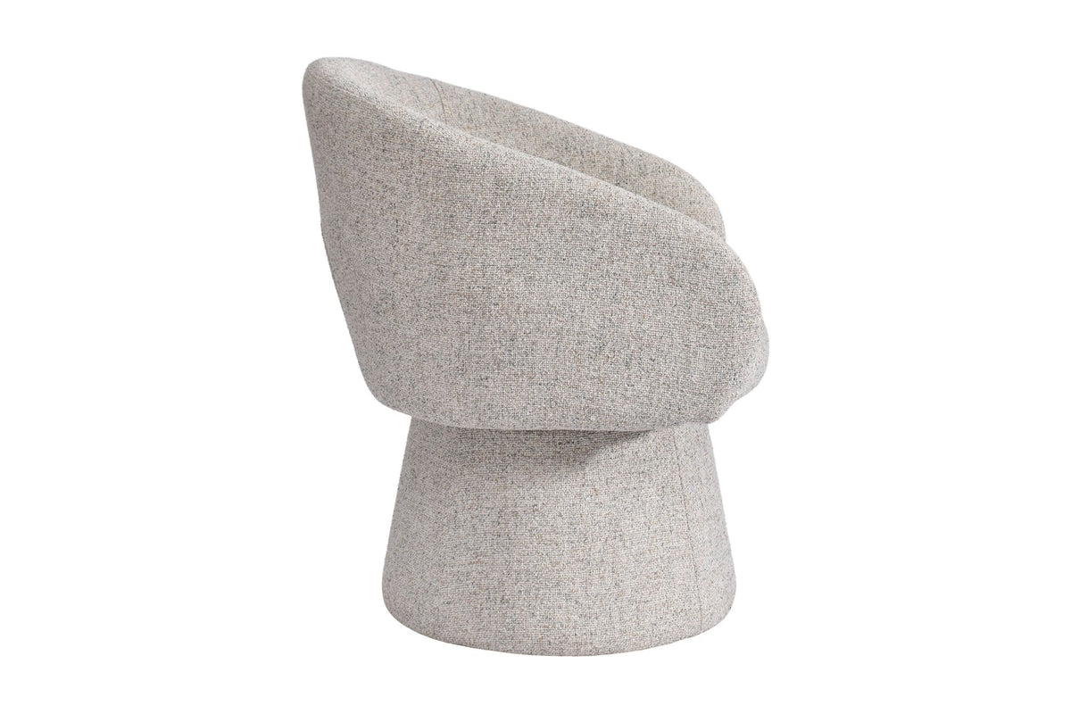 Finley accent chair side view showing the curved back and pedestal base