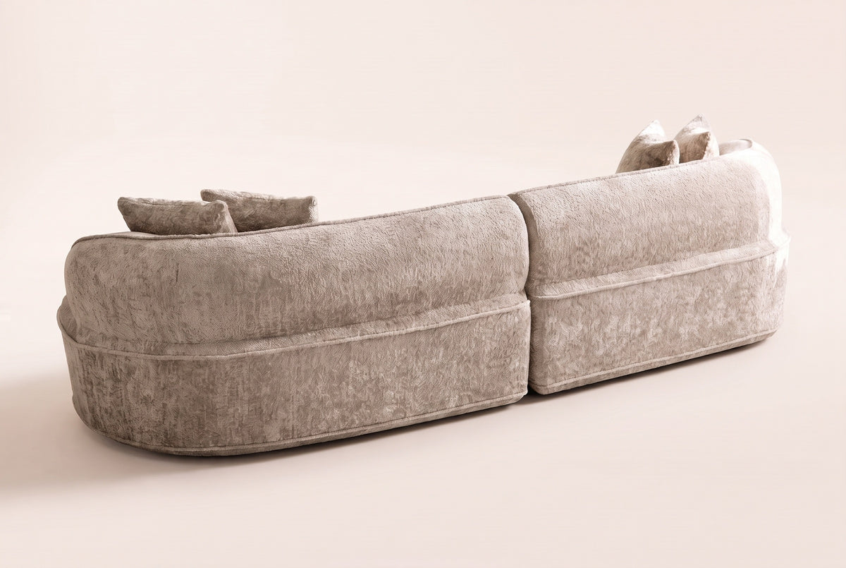 The Fiora curved sofa in Camel from behind