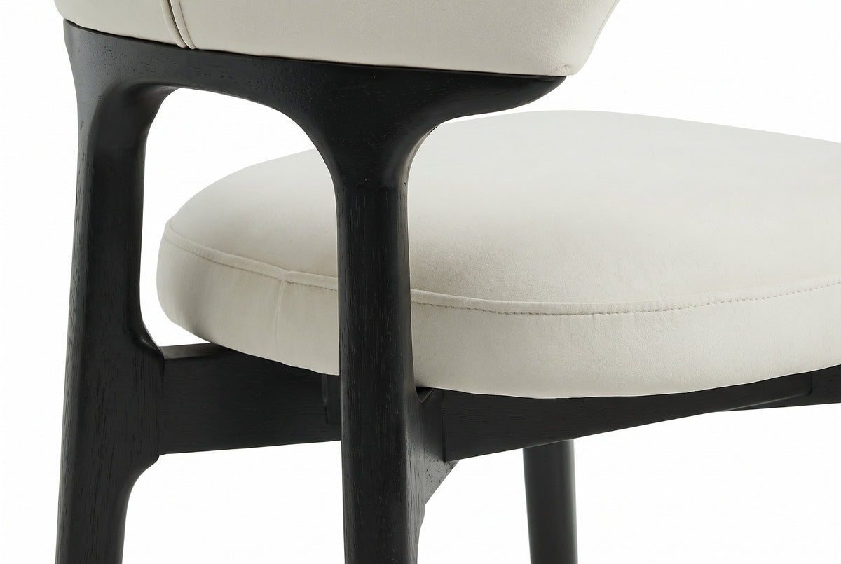 Close-up from behind of the Fosdinovo black wood back post flowing into the yoke under the cream backrest