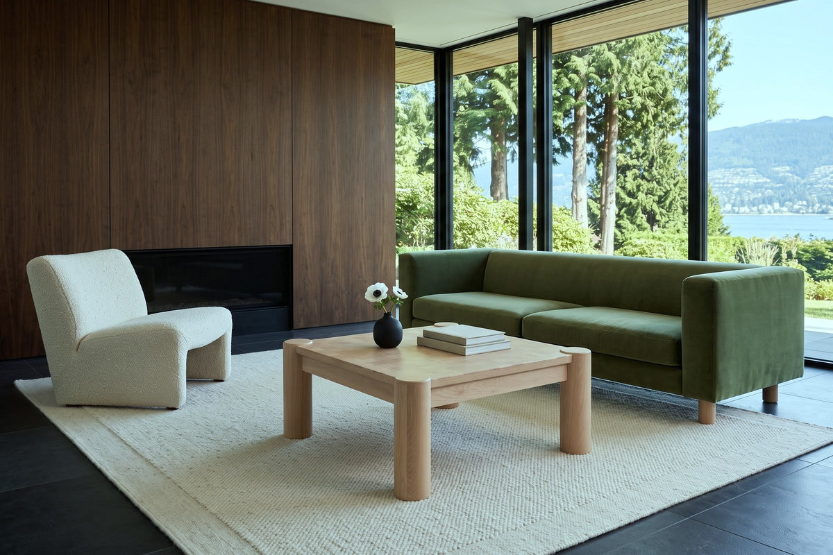 Furore coffee table in Biscotti Oak in a Point Grey house, with a dark walnut fireplace wall