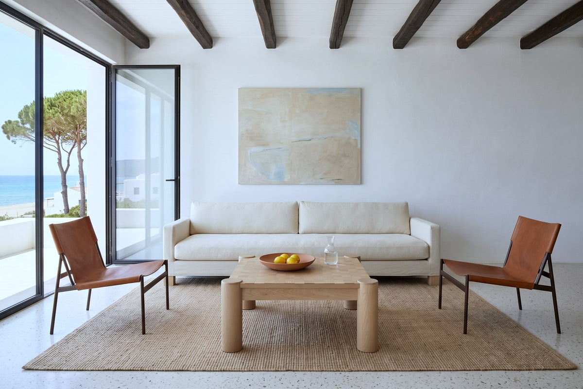 Furore coffee table in Biscotti Oak in a Sperlonga villa, with white lime plaster, juniper beams, a cream canvas sofa