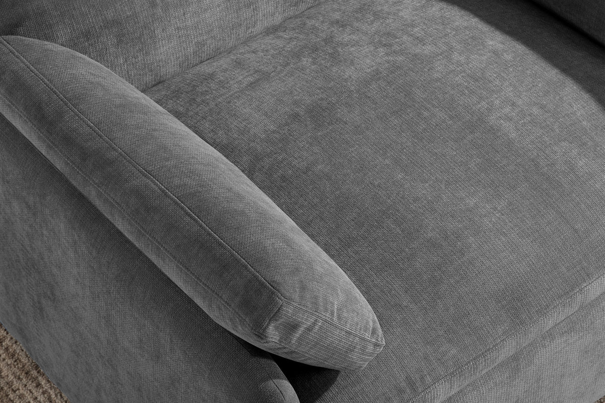 Close-up of the charcoal gray chenille seat cushion, a throw pillow and the rounded arm