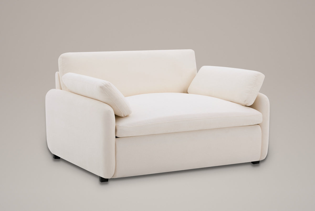 Gallipoli oversized chenille accent chair in ivory white, three-quarter view on a warm grey studio backdrop