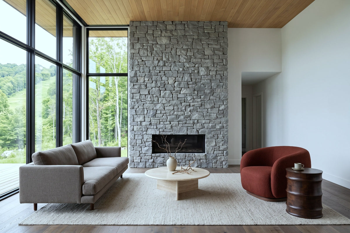 Gangi side table in Walnut beside a rust boucle lounge chair in a Bromont mountain house