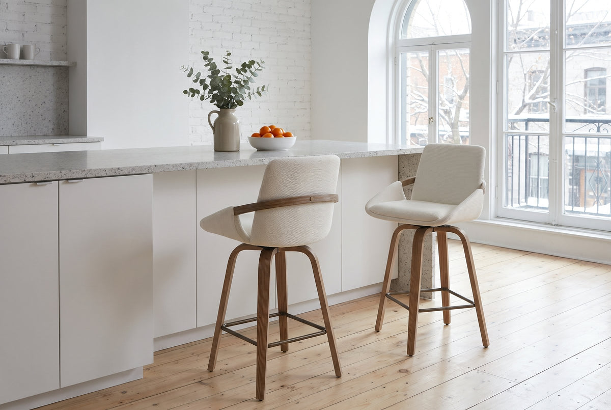 Two Gardone counter stools in ivory at a white island with a terrazzo top in a Montreal loft kitchen