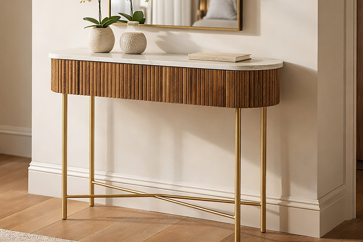 Gideon walnut console table with marble top in an entryway below a mirror