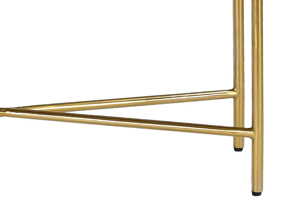 Close-up of the Gideon aged gold wrought iron leg and X stretcher