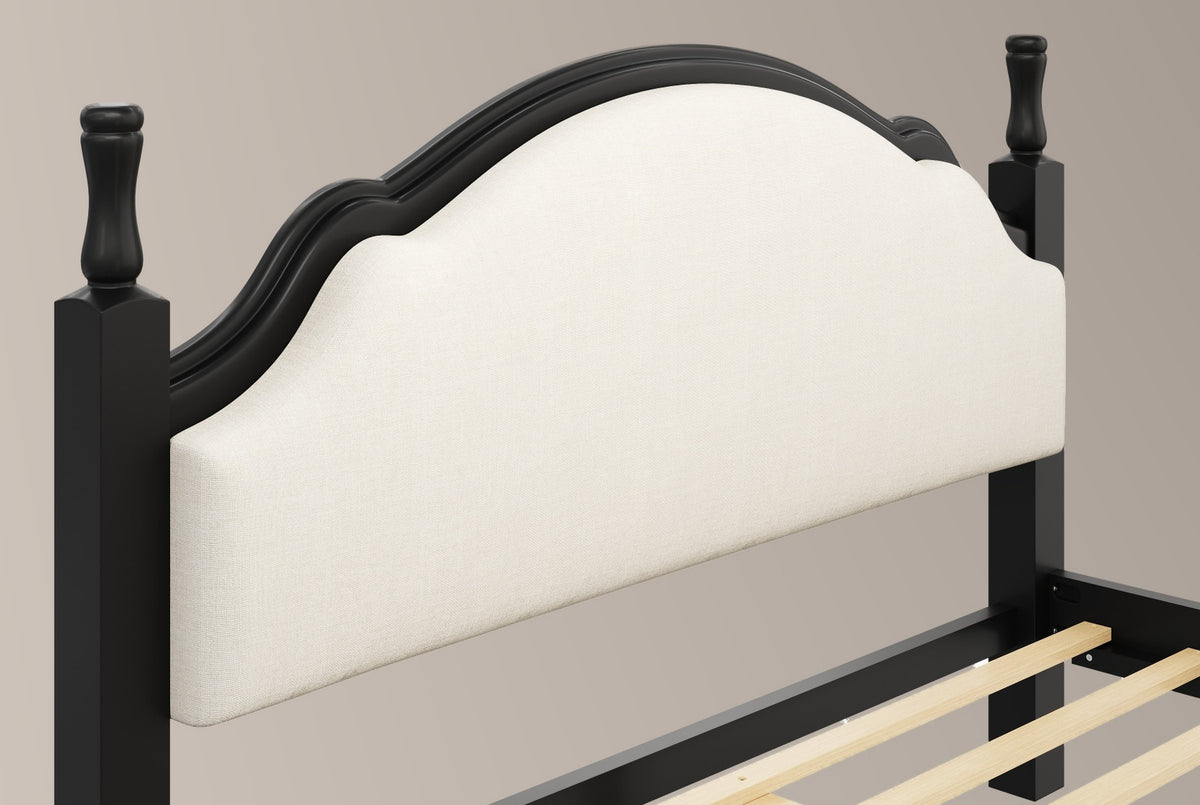 Close-up of the black Gradara headboard: two turned finials, the moulded crest and the beige linen-look panel