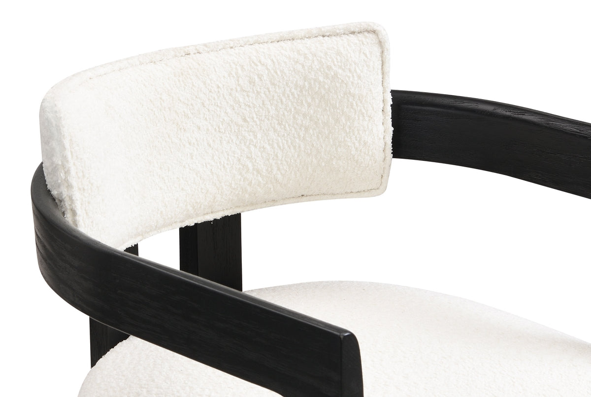 Close-up of the Gradisca floating back pad, the curved wooden rail and the piped seat: ivory boucle on the Black frame