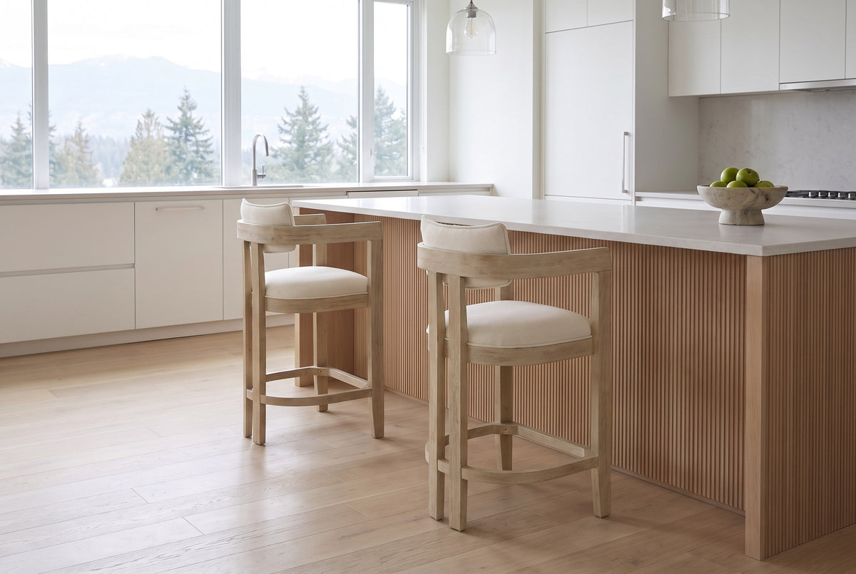 Two Gradisca counter stools in Natural Ash at a pale oak island in a bright Vancouver kitchen with mountain views