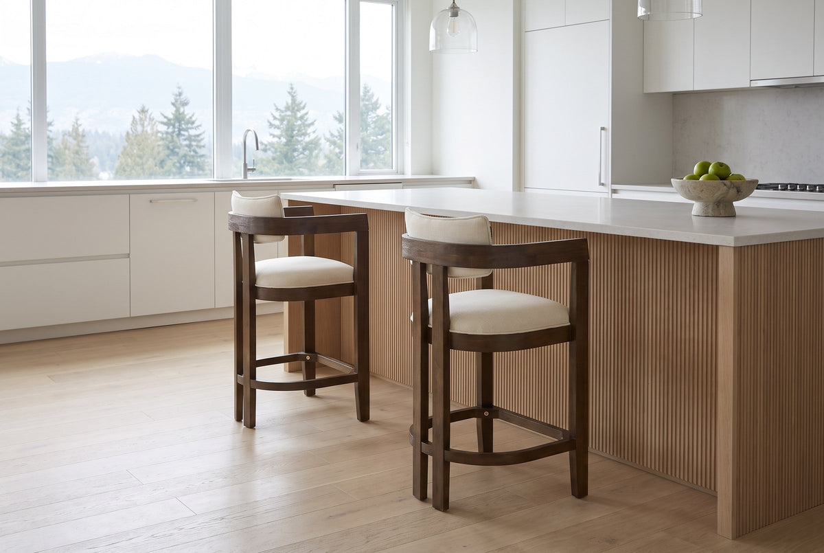 Two Gradisca counter stools at a pale oak island in a bright Vancouver kitchen with mountain views