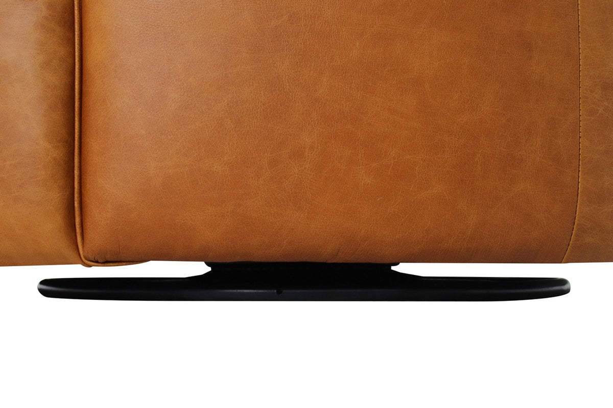 Black steel swivel base under the Hollis Saddle leather chair