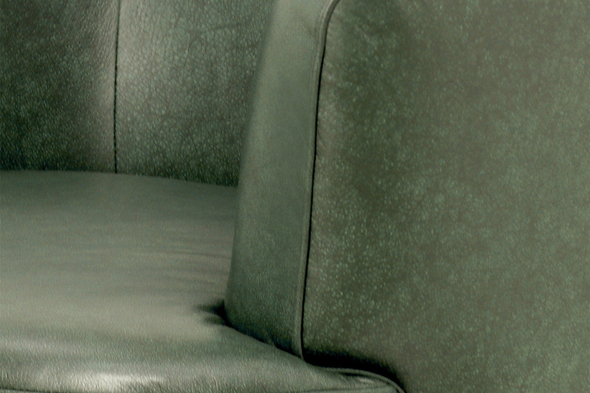 Close-up of the Forest Green top-grain leather arm and seat cushion