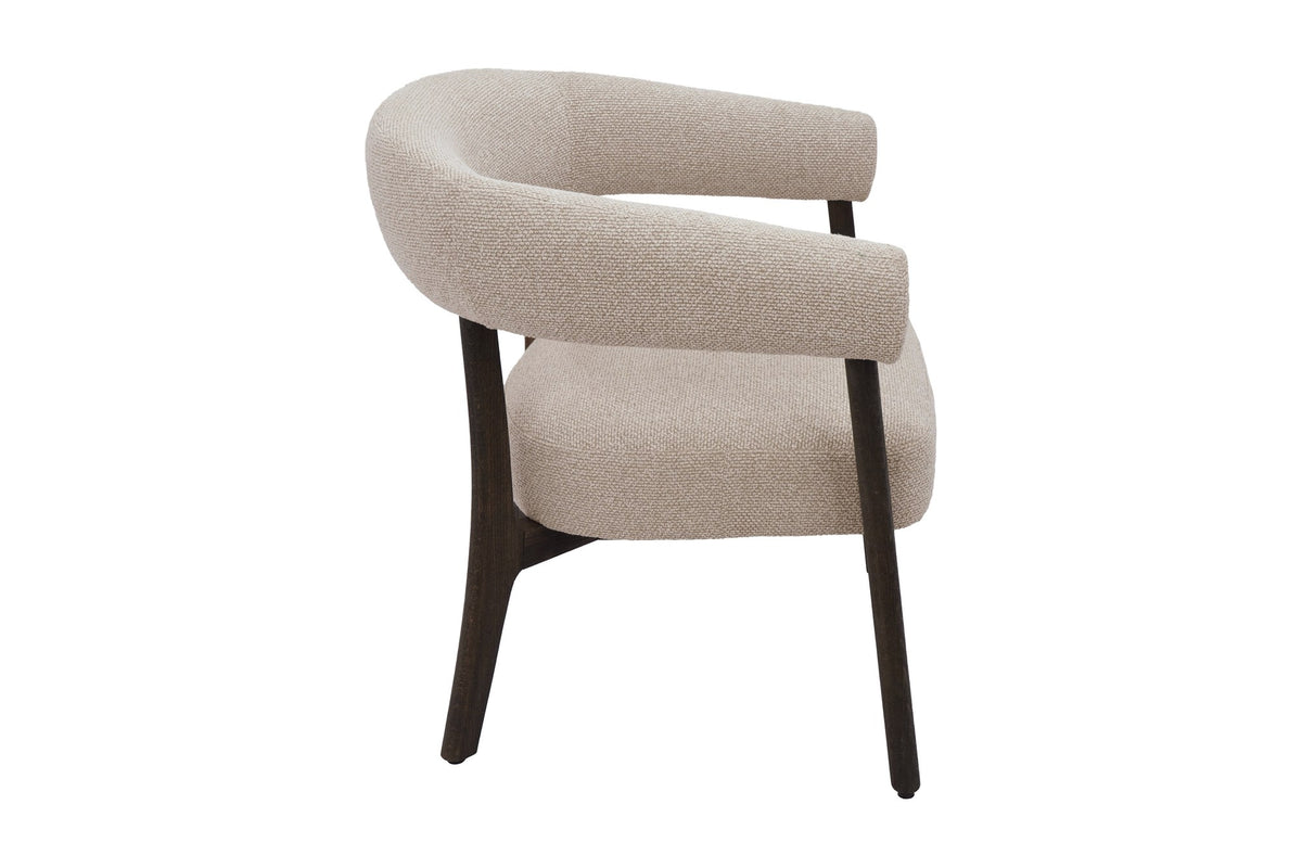 Jolie oat accent chair side view showing the wraparound arm and walnut-finish legs