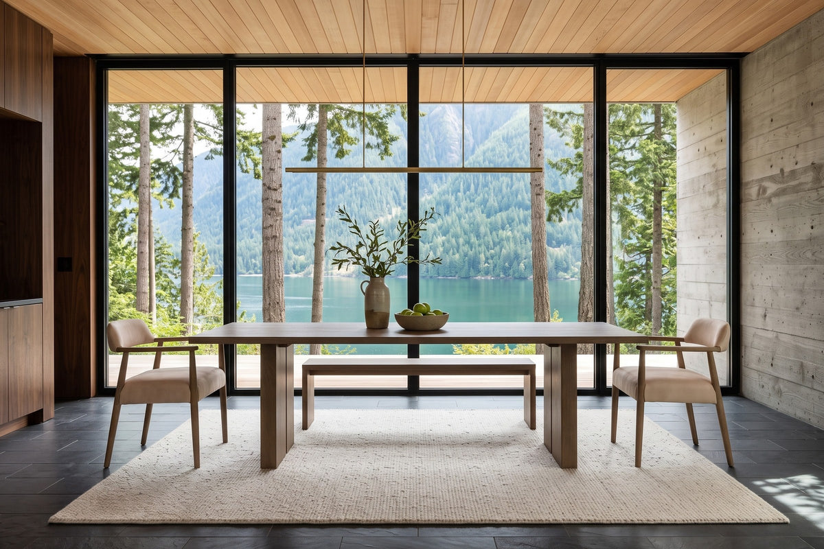Laigueglia armchairs in Beige leather at each end of a smoked-oak table in an Egmont house