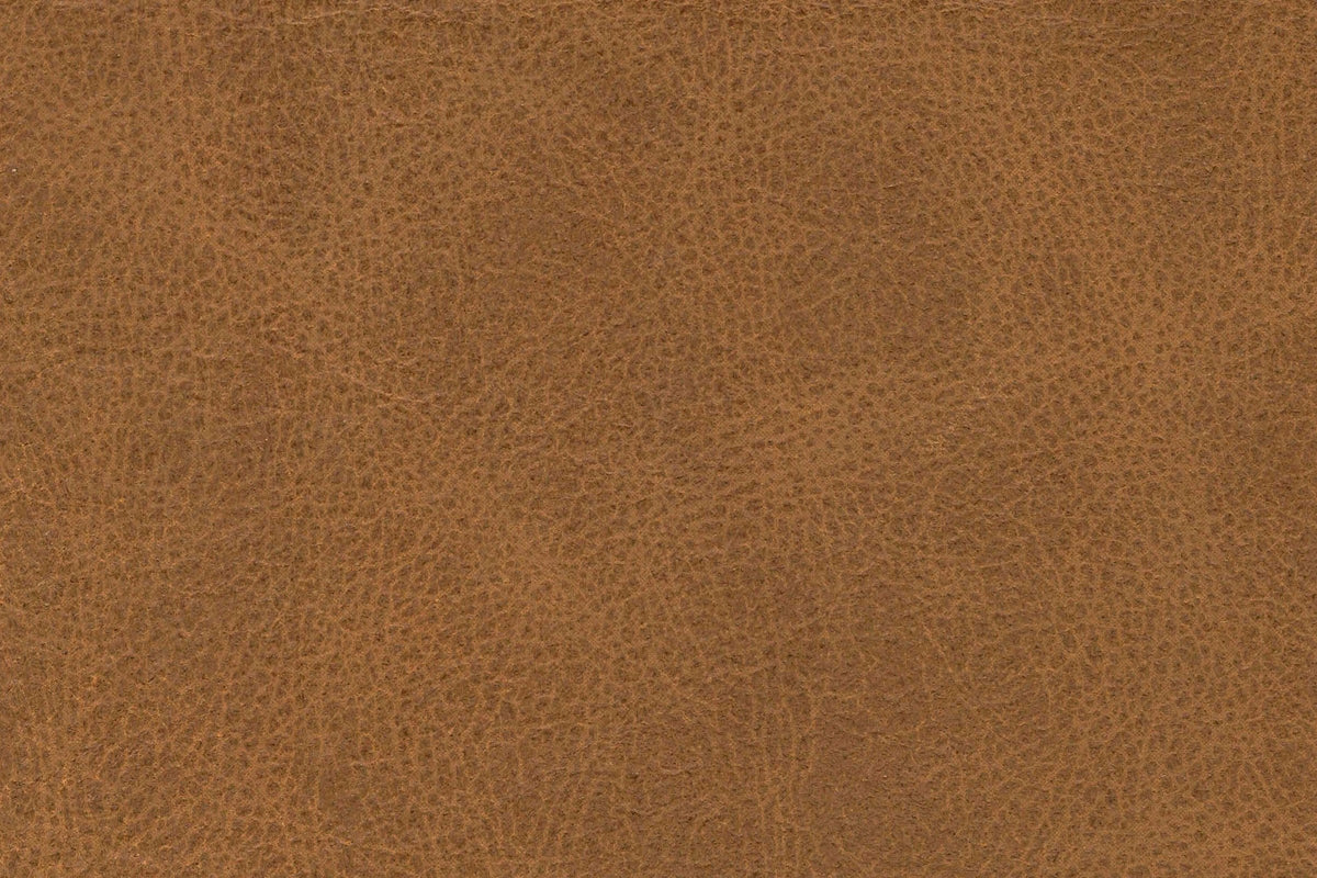 Close-up of the Brown top-grain leather: a fine pebbled grain with darker and lighter patches
