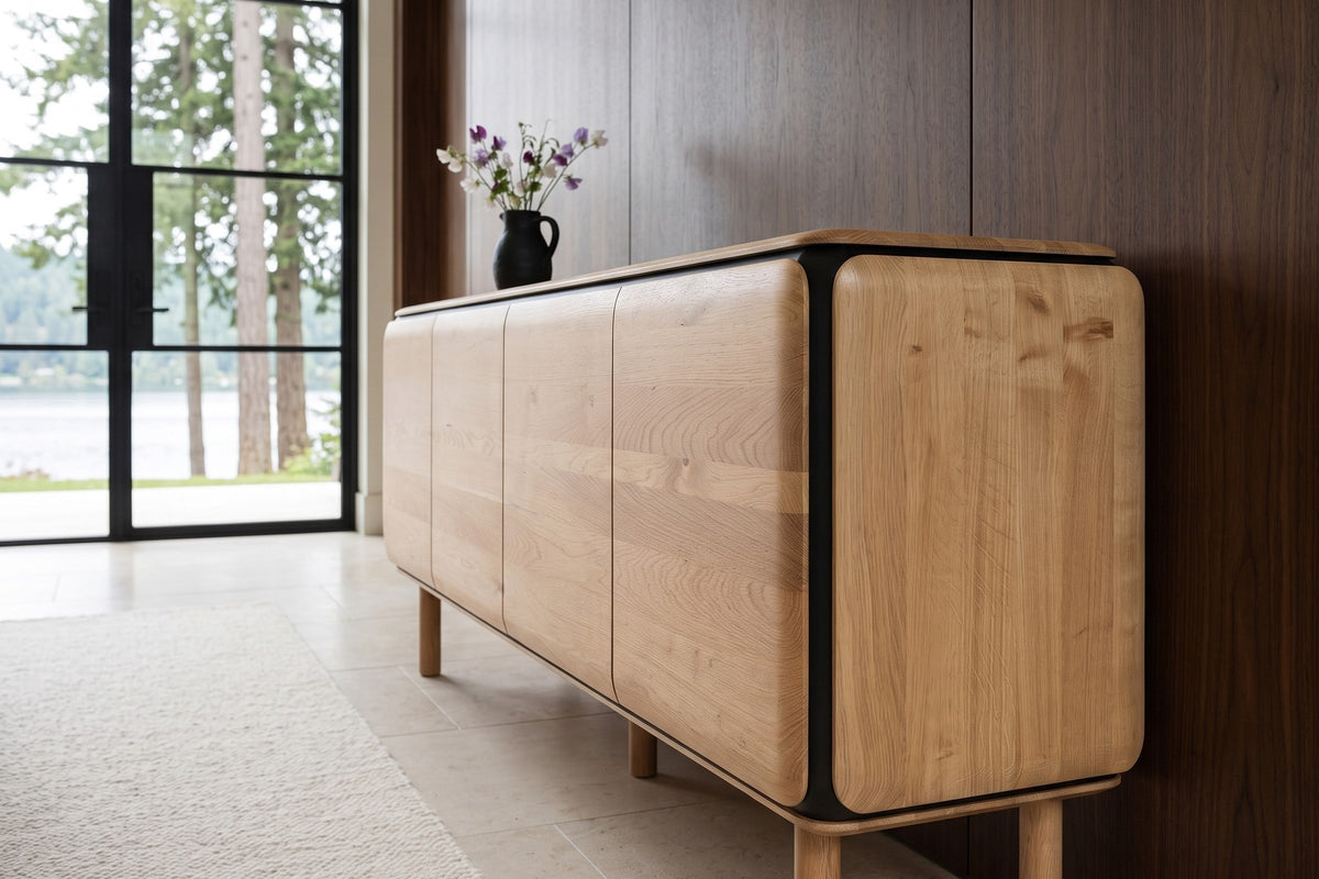 Larino sideboard in Natural and Black seen from the end against walnut panelling in a Shawnigan Lake house