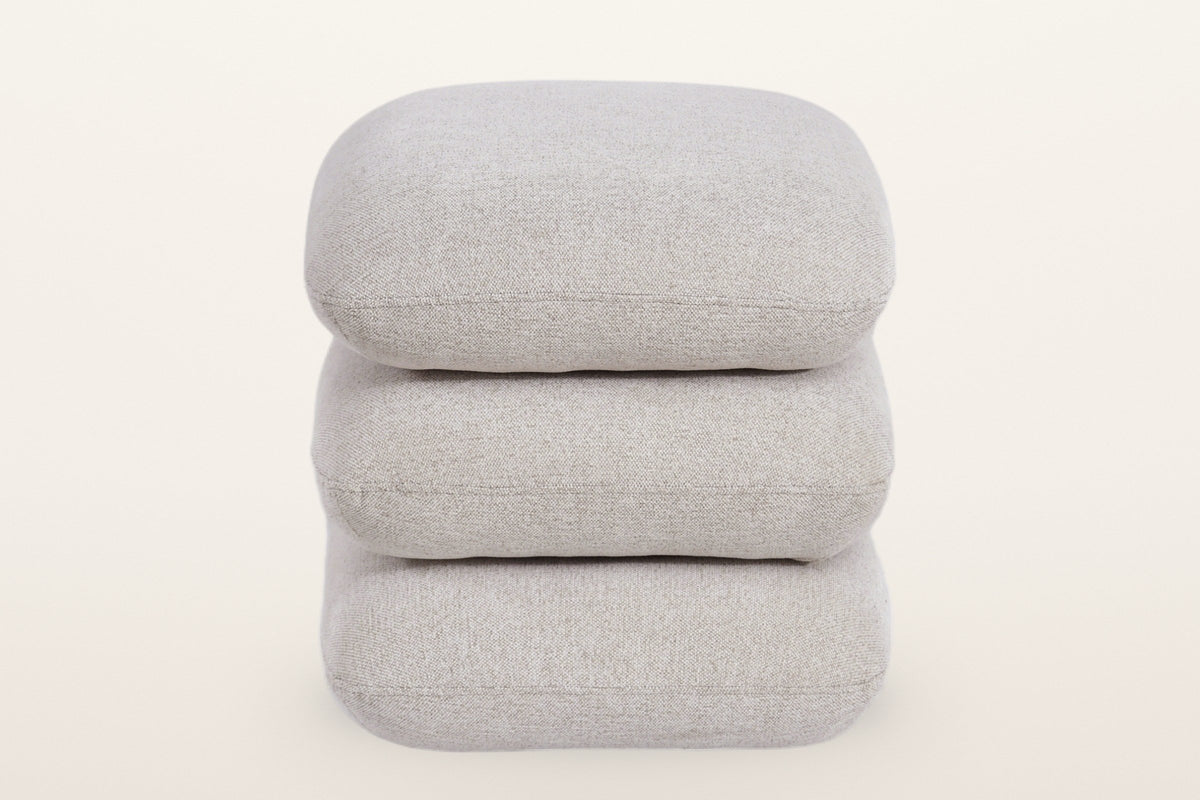 Lavagna square ottoman in Beige from the front: three pillows stacked squarely, each with one fine seam