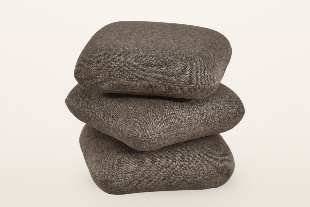 Lavagna ottoman in Brown with the top two pillows turned at an angle: they swivel