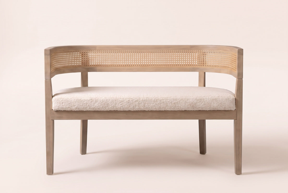 Levanto loveseat in beige boucle and natural ash, straight front view: a woven rattan band wrapping the back and arms, one long seat pad and four square legs