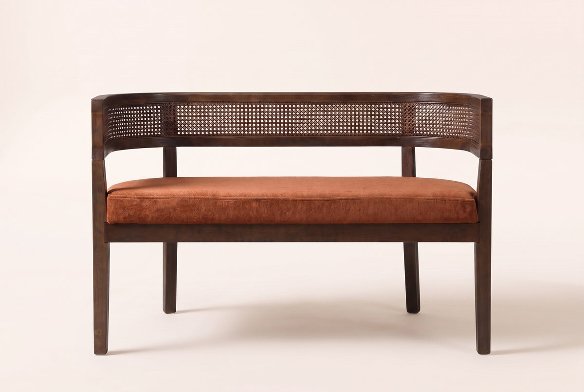 Levanto loveseat, straight front view: a woven rattan band wrapping the back and arms, one long seat pad and four square legs
